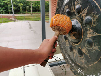 Midsection of woman holding pumpkin