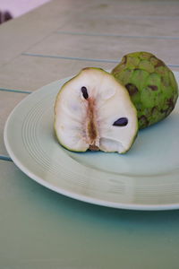 Close-up of fruit in plate on table