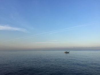 Scenic view of sea against blue sky