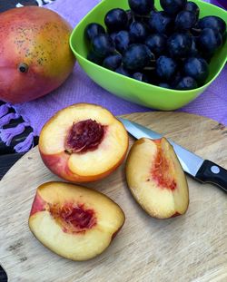 Close-up of cut nectarine on cutting board