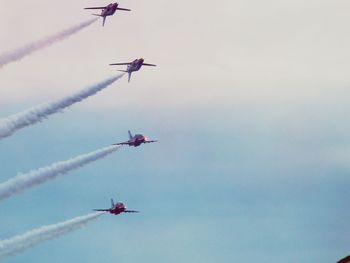 Low angle view of airplane flying in sky