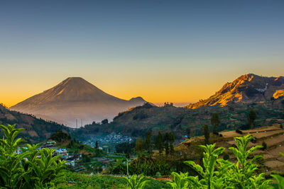 Scenic view of mountains against sky during sunset