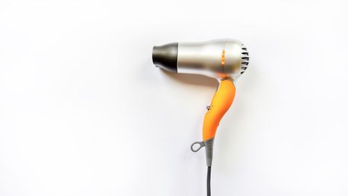 Close-up of electric lamp against white background