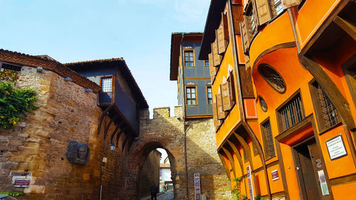 Low angle view of buildings against sky in city