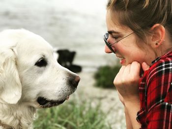 Close-up of woman looking at dog