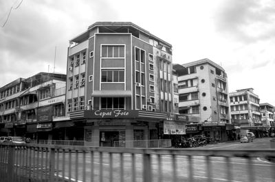 View of buildings against cloudy sky