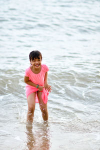 Portrait of a smiling woman in water