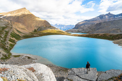 Scenic view of lake and mountains against sky