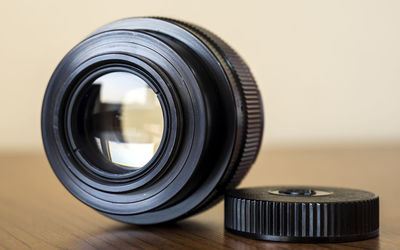 Close-up of camera lens on table