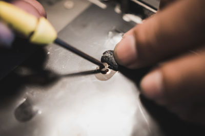 Close-up of hands working