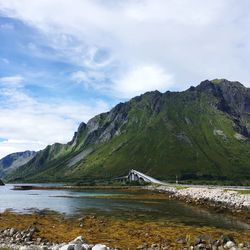 Scenic view of bridge over mountains against sky