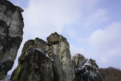 Rock formations on mountain against sky