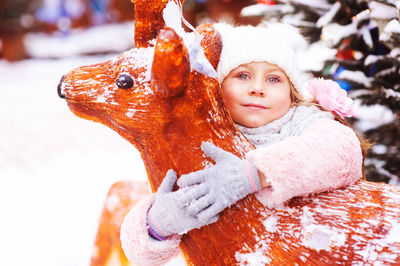 Portrait of smiling girl with snow