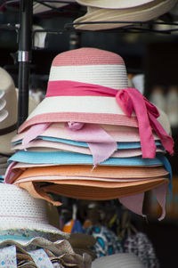 Close-up of colorful hats on shelf at store