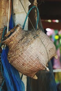 Close-up of clothes hanging on rope at market