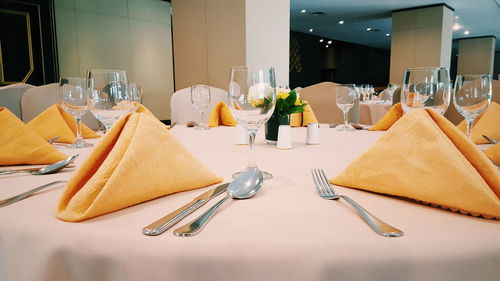 Place setting on table at restaurant