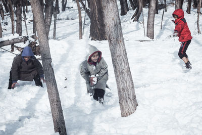 People on snow covered land