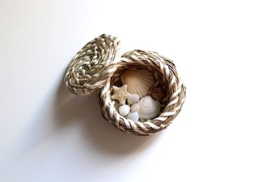 High angle view of wicker basket on white background