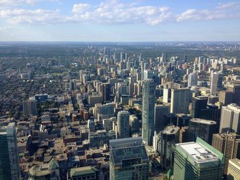 High angle view of modern buildings in city against sky