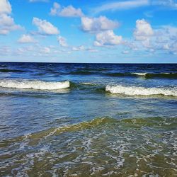 Scenic view of sea against cloudy sky