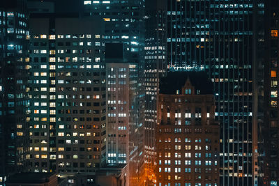 Illuminated buildings in city at night