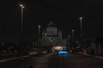 Illuminated buildings in city at night