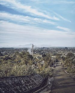 Panoramic shot of road on field against sky