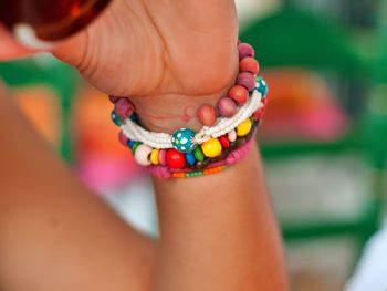Cropped image of hand wearing bracelets
