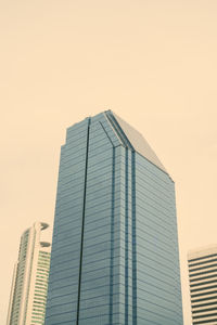 Low angle view of modern buildings against clear sky