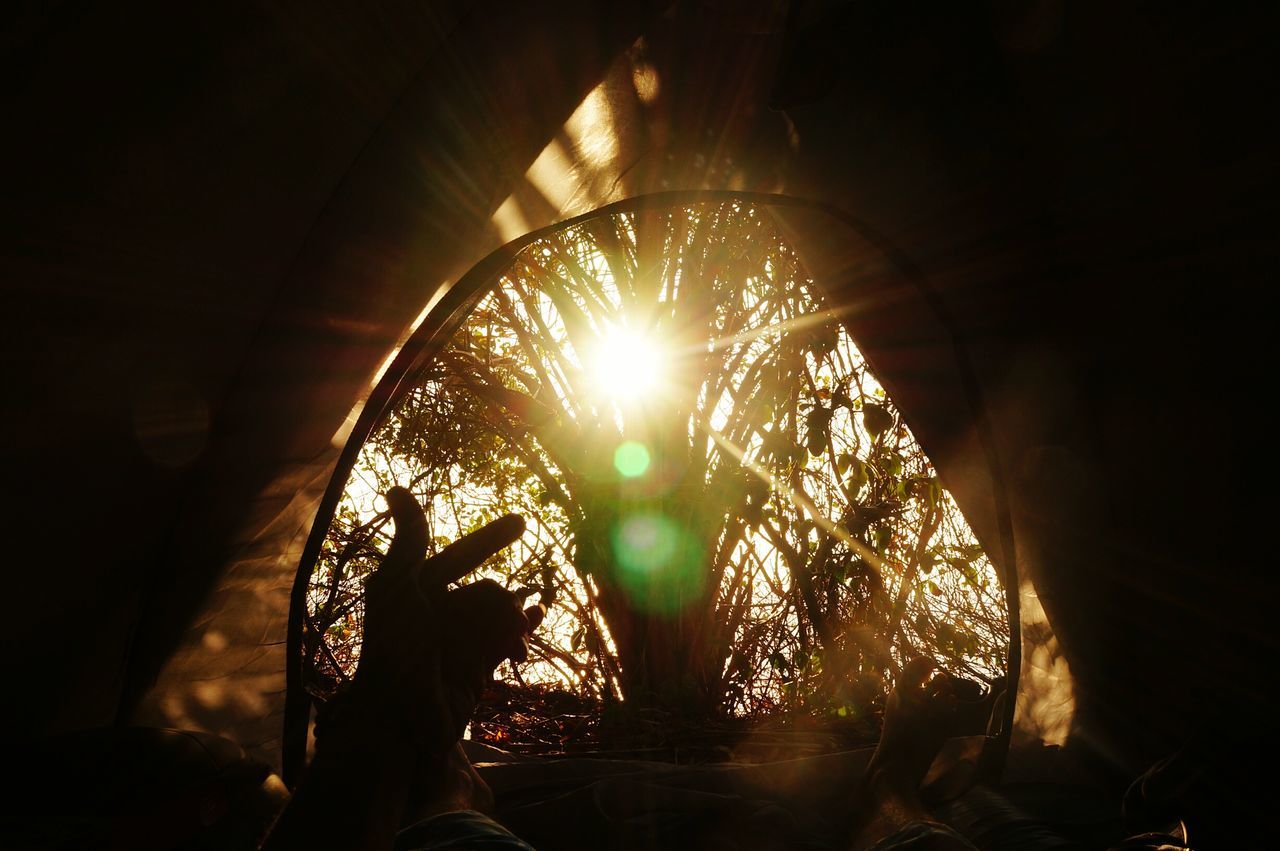 LOW ANGLE VIEW OF ILLUMINATED LIGHTING EQUIPMENT IN SUNLIGHT