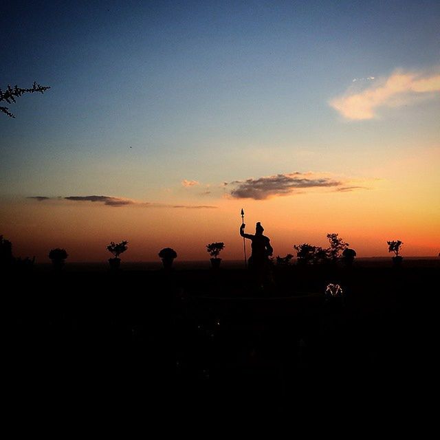 sunset, silhouette, transportation, sky, mode of transport, land vehicle, orange color, men, copy space, dusk, scenics, cloud - sky, outdoors, travel, nature, flying, riding, beauty in nature, leisure activity