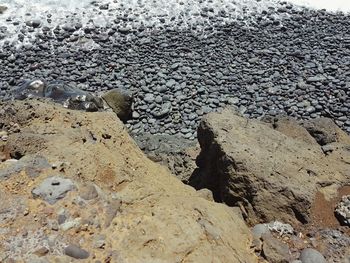 High angle view of stones on beach