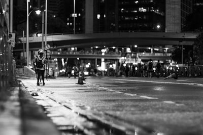 People walking on road at night