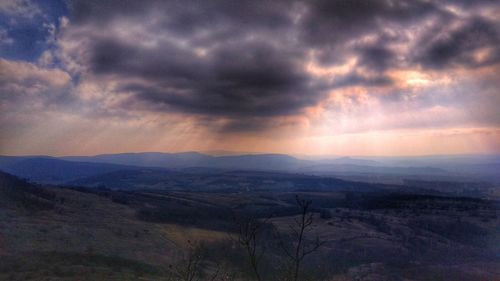 Scenic view of landscape against sky during sunset