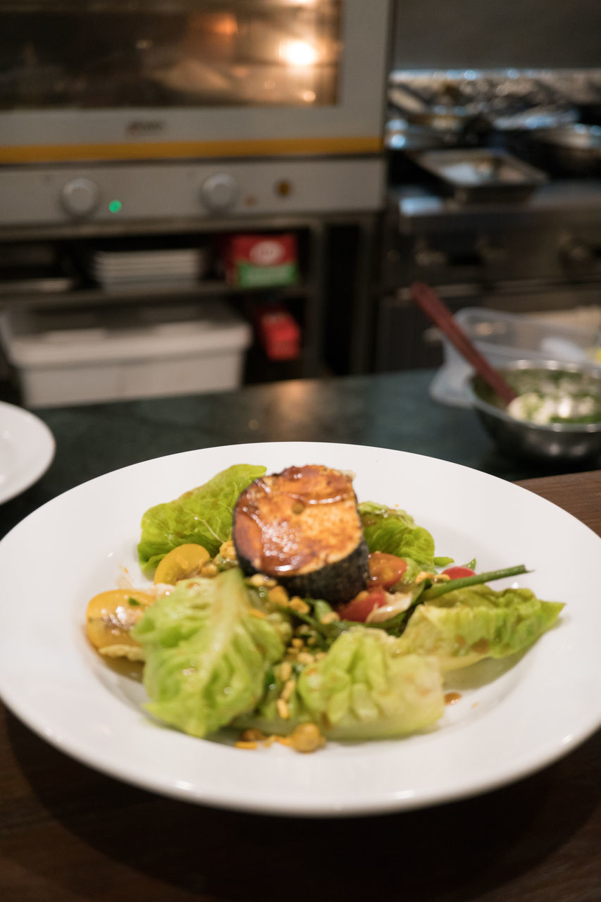 CLOSE-UP OF FOOD SERVED ON TABLE