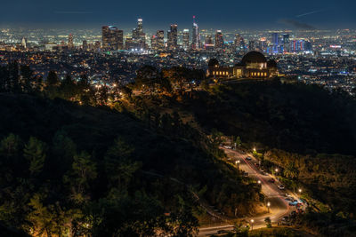 High angle view of illuminated buildings in city at night
