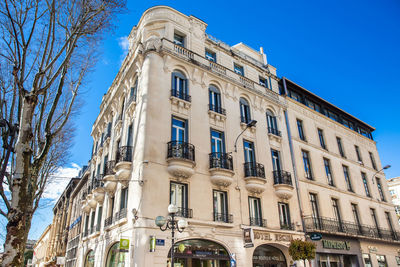 Low angle view of building against blue sky