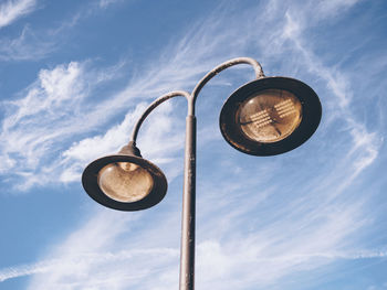 Low angle view of street light against sky