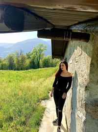 Full length of woman standing on grass