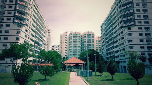 Buildings in city against sky