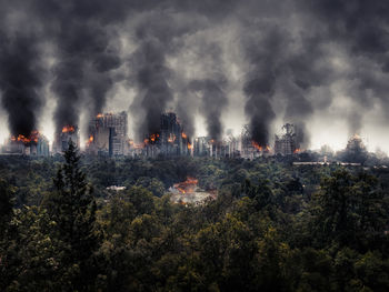 Panoramic view of trees and buildings against sky