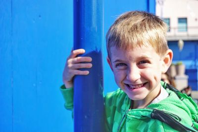 Portrait of boy smiling outdoors