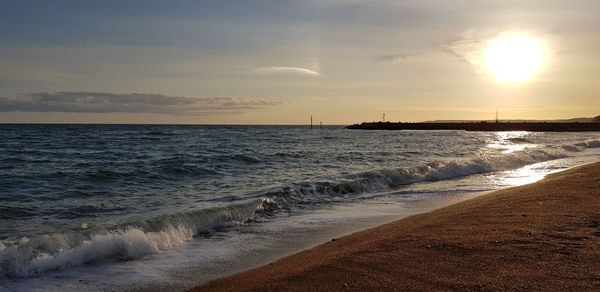 Scenic view of sea against sky during sunset