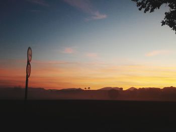 Scenic view of silhouette landscape against sky during sunset