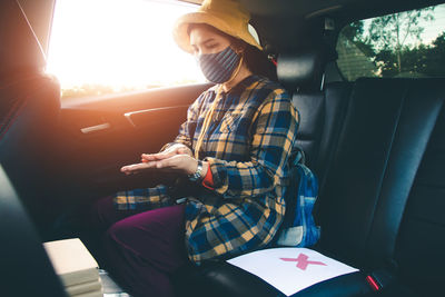 Woman sitting in car