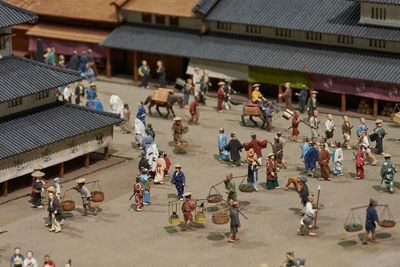 High angle view of model depicting people and buildings of historic japan