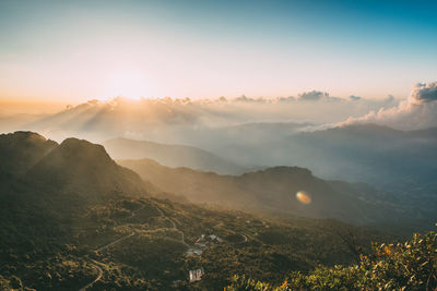 Scenic view of mountains against sky during sunset