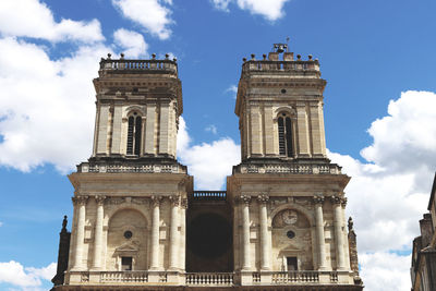 Low angle view of cathedral against cloudy sky