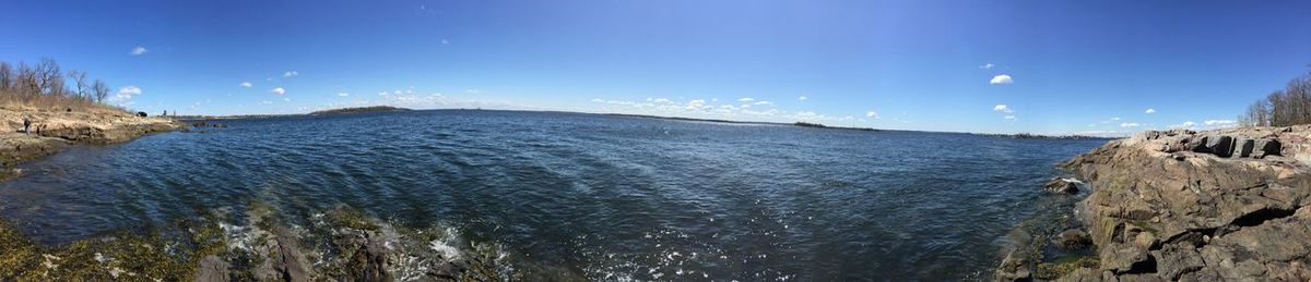 Scenic view of sea against blue sky