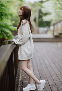 Young woman standing in city